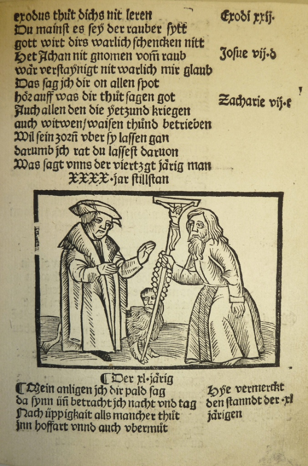 Ein Blatt mit gedrucktem Text in einer unbekannten Sprache, mit zwei Männern daneben, möglicherweise aus einem Lehrbuch.