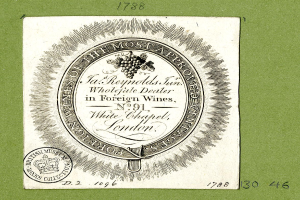 Plakat mit grünem Hintergrund, das den Text 'Das am meisten genehmigte bei ausländischen Weinen' und ein rundes Logo mit einem weißen Zentrum und einem schwarzen Rand zeigt.